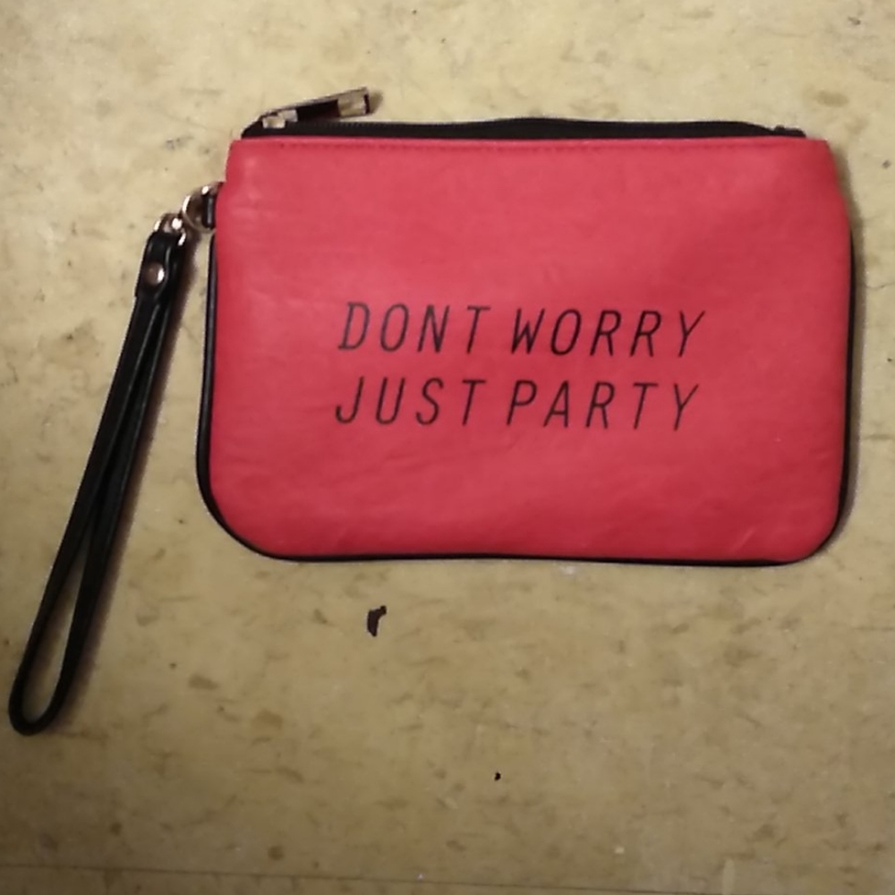 A pink and black (don't worry just party)purse.